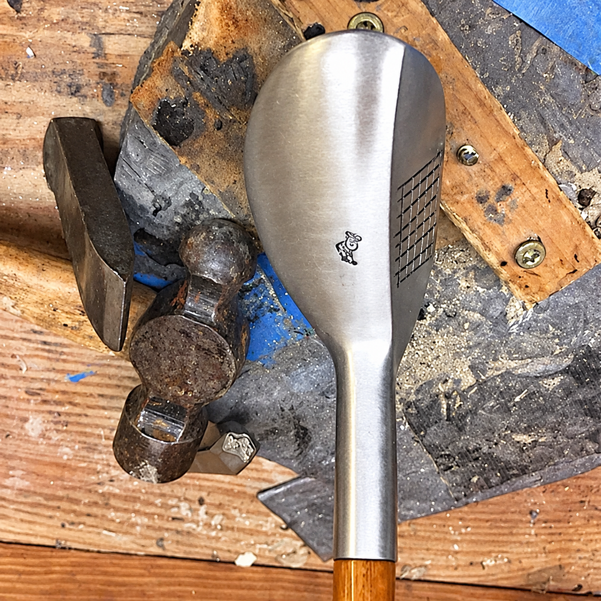 Mills MSD Compact-Head left hand Aluminum Hickory Playclub on a workshop bench