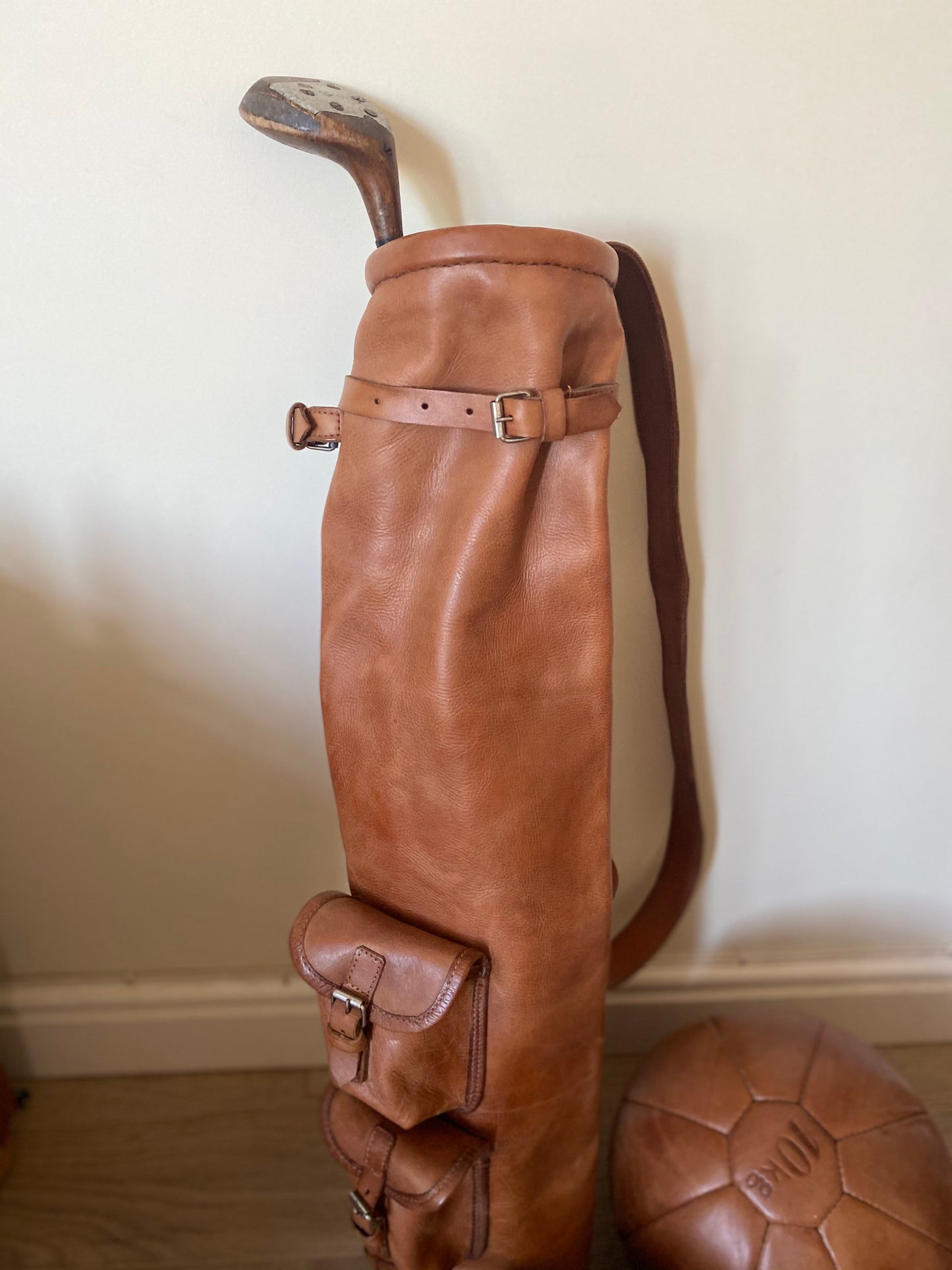 Handcrafted vintage leather golf bag in tan color with shoulder strap