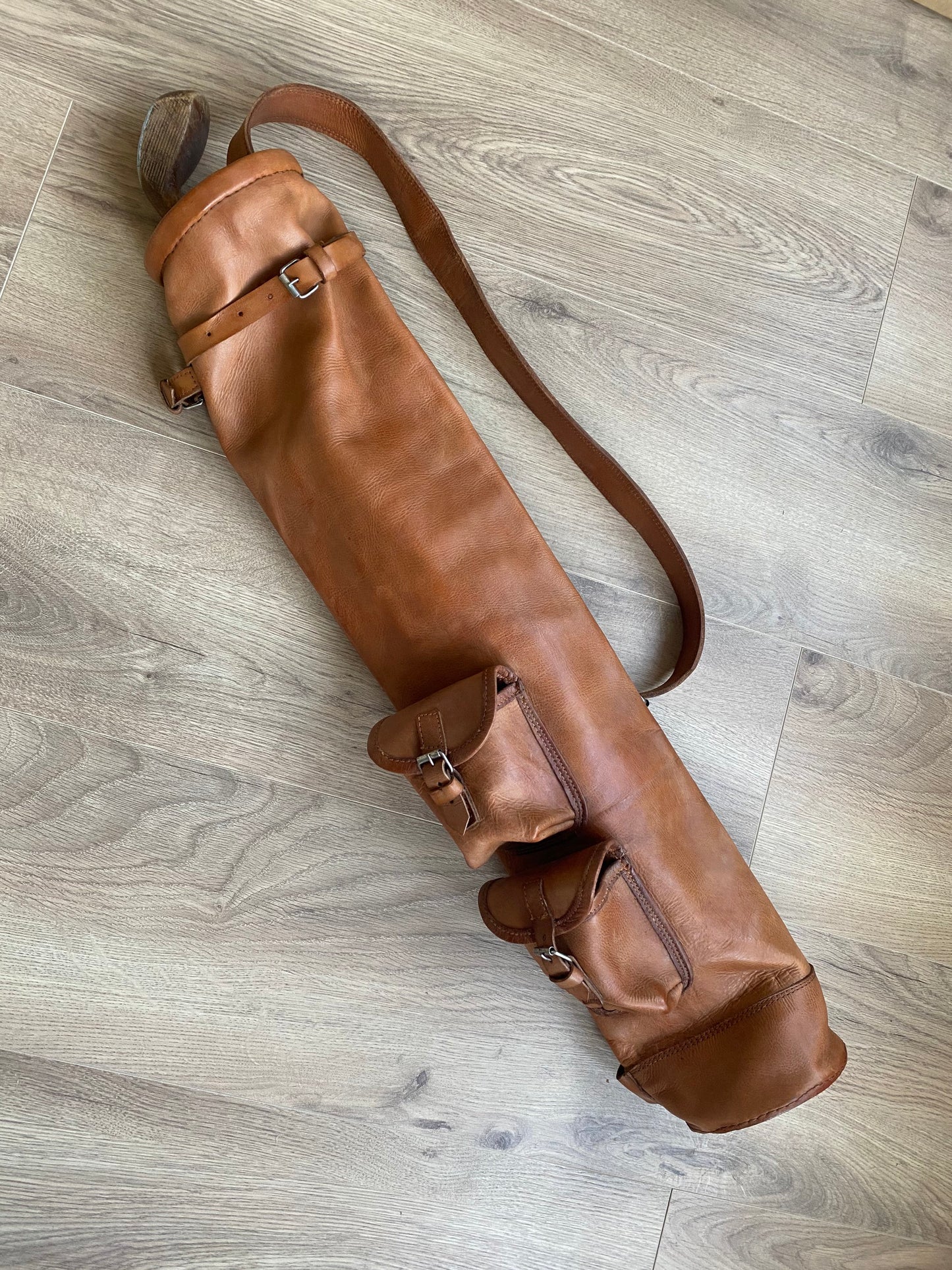 Handcrafted vintage leather golf bag in tan color with shoulder strap