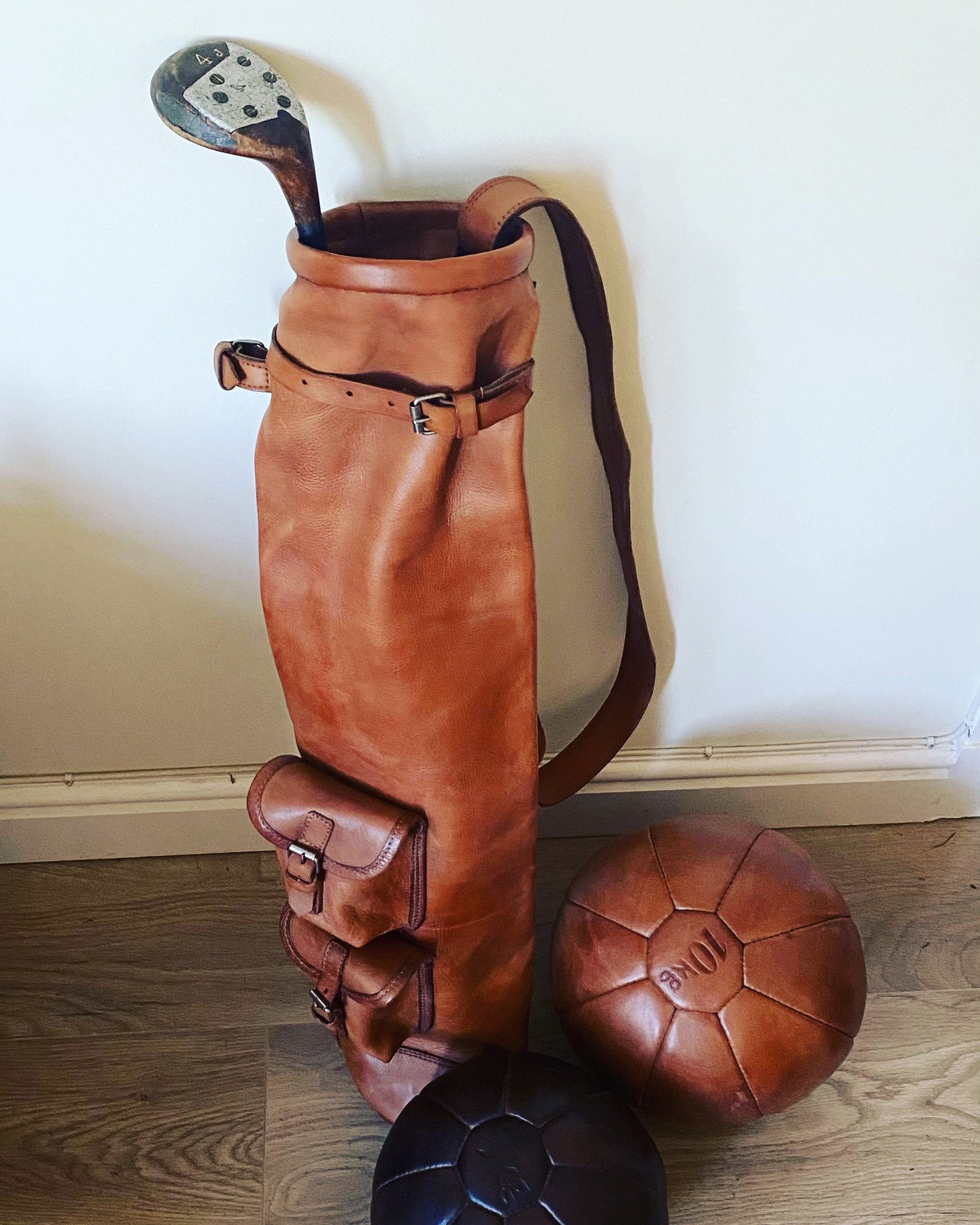 Handcrafted vintage leather golf bag in tan color with shoulder strap