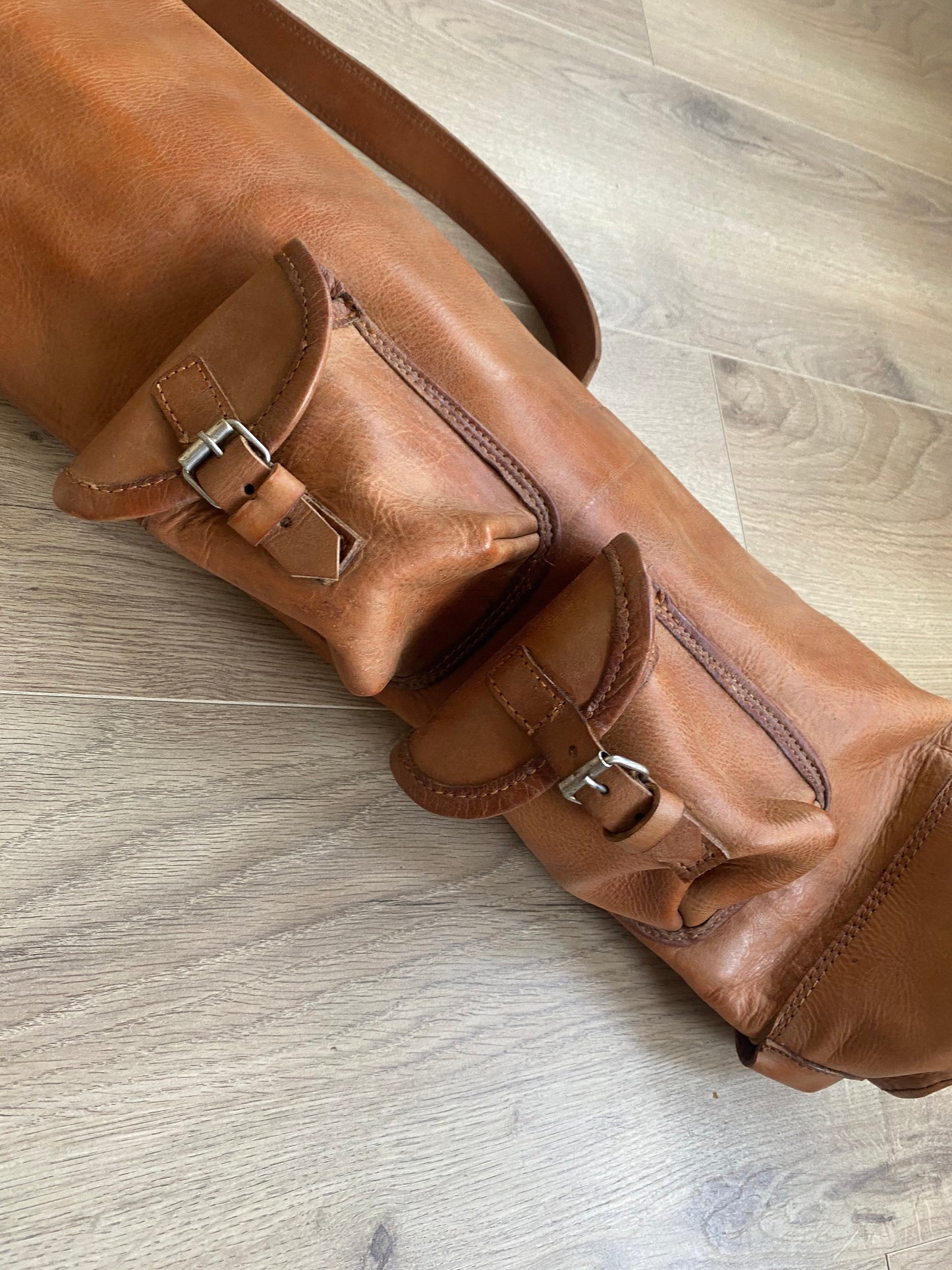 Handcrafted vintage leather golf bag in tan color with shoulder strap