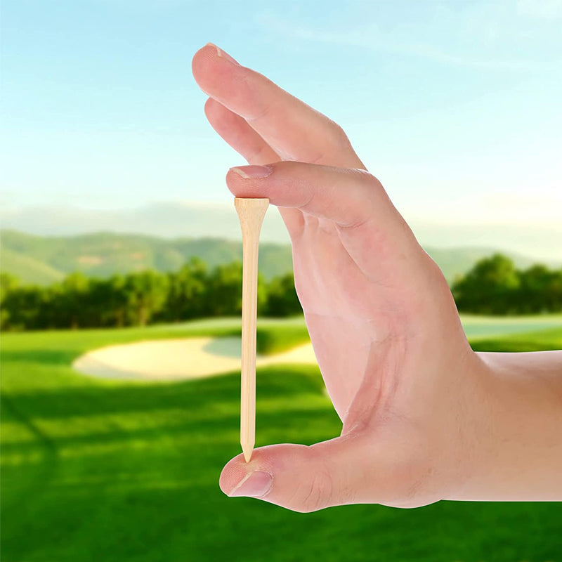 Hand holding a bamboo golf tee with a golf course in the background, showcasing the eco-friendly and high-quality design of the tees.