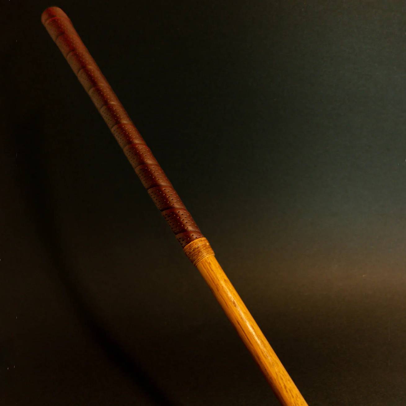 Otey hickory putter refurbishment showing restored shaft, leather grip, and classic brass head
